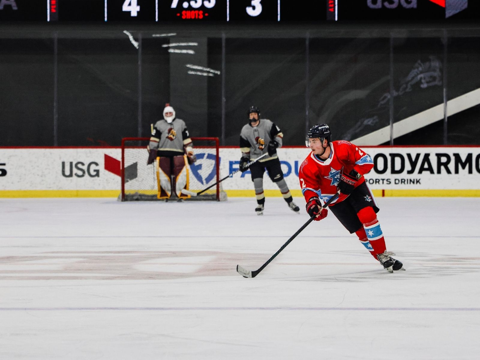 Misfits forward skating into the zone on the attack